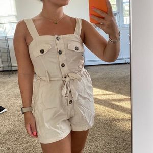 Safari romper with synched tie waist.